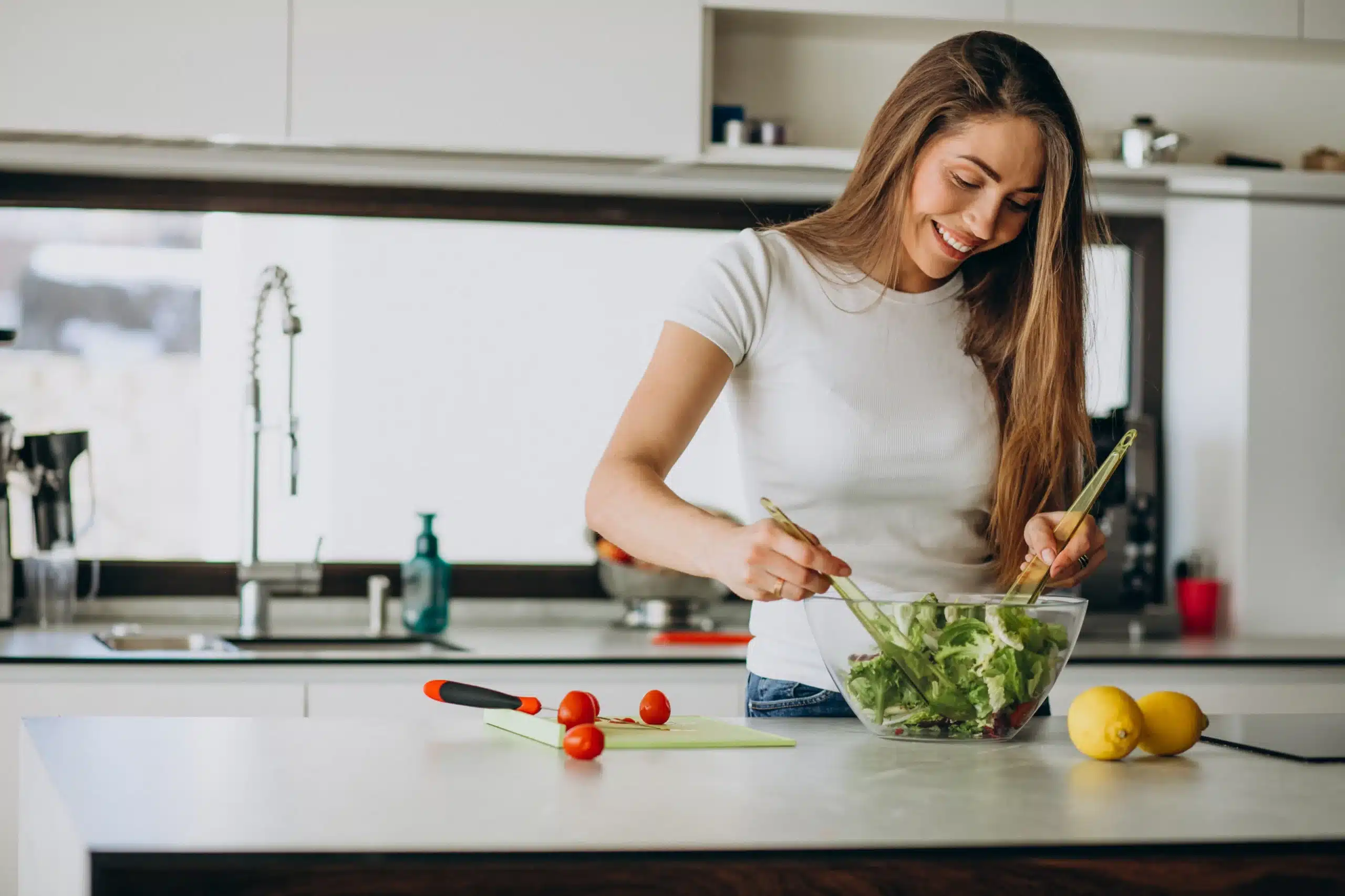 Lila in the kitchen making salad