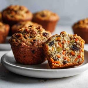 Morning glory muffins sliced open with carrots, raisins, and apples