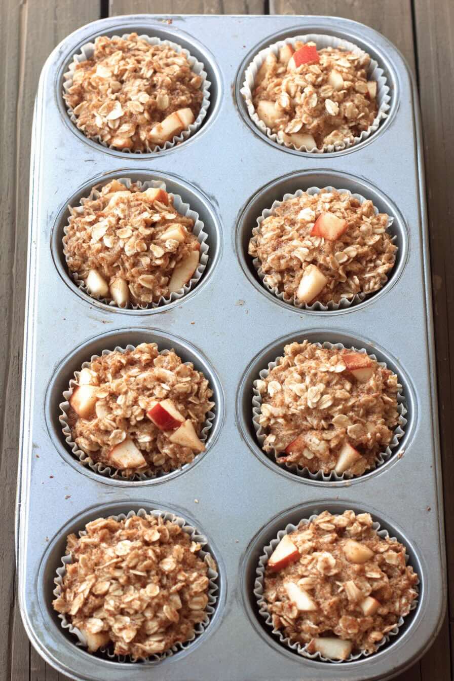 Unbaked apple cinnamon oatmeal cups in muffin tin
